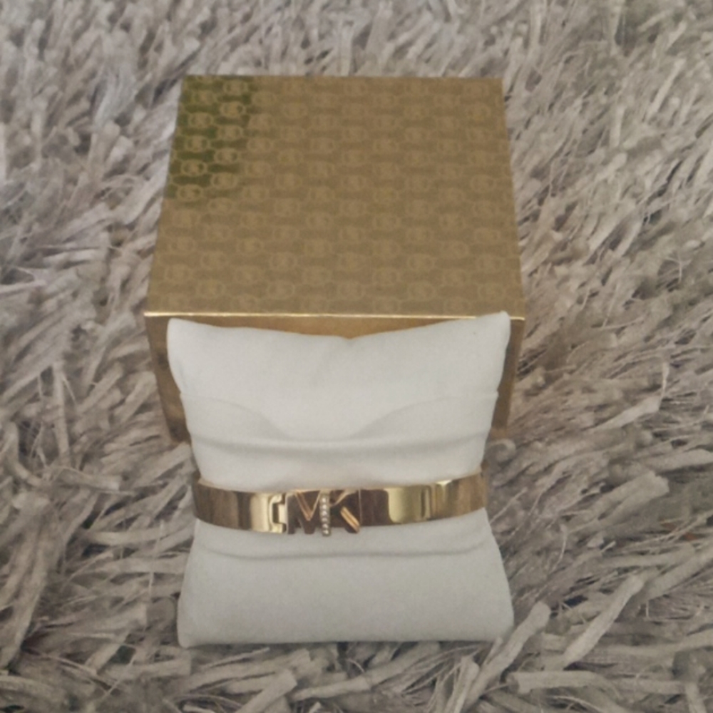 Michael kors mk gold tone stainless steel faux diamond accent lock bracelet.